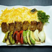 Beef Shish Kabob Plate · Charbroiled chunks of marinated filet mignon. Served with rice, charbroiled tomato, salad, a...