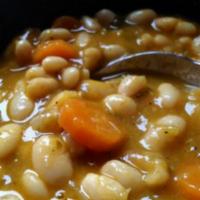 Cannellini (Fasule) Soup · White bean soup with bay leaves and tomatoes served with pita bread.