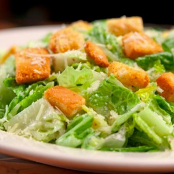 Caesar Salad · Classic Caesar salad served with pita bread.
