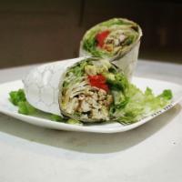 Chicken Avocado Wrap · Chicken wrap with lettuce, tomatoes, onions, avocado and feta cheese.