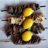 Mixed Meat · Chicken skewers, pork skewers and Qofte served with pita bread and tzatziki and house salad.