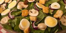 Fresh Spinach Salad · Fresh spinach leaves with slices of hard boiled egg, sliced red onion, fresh sliced mushrooms and croutons. Add chicken for an additional charge. 