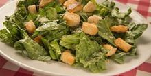 Caesar Salad · Crispy romaine lettuce and shaved Parmesan cheese and herbed croutons. Add chicken for an ad...
