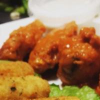 Buffalo Wings · Served with blue cheese.