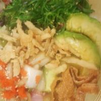 Spicy Tuna Poke Bowl · Spicy tuna, seaweed salad, avocado, cucumber, lettuce, Spring mix, snack mix, and sesame see...