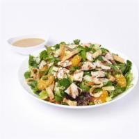 Signature Chinese Salad · Organic spring mix, romaine, iceberg and carrots with mandarin oranges, fresh cilantro, gree...