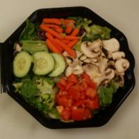 Family Size Garden Salad · Mixed green salad with mushrooms, tomatoes, cucumbers, carrots and our own garlic Parmesan c...