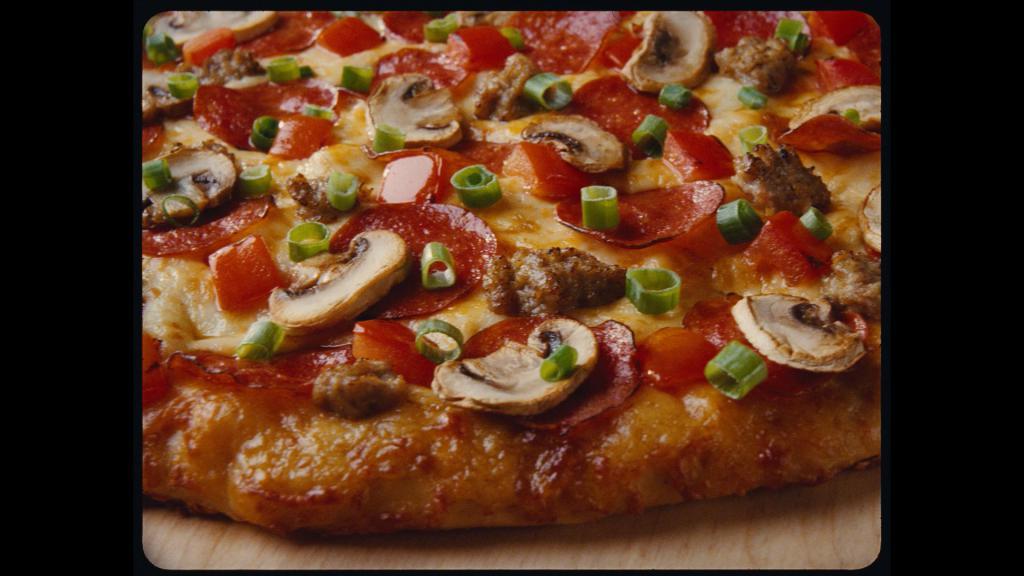 Italian Garlic Supreme® Pizza · Pepperoni, Italian sausage, tomatoes, mushrooms, green onions and lots of garlic on creamy garlic sauce.
