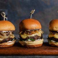 Beach Burger Sliders · Three juicy mini-burgers topped with peppered mayo and sauteed onions on lightly toasted bun...