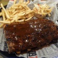 Hurricane Ribs · Smoked baby back ribs served with your choice of BBQ sauce. Served with your choice of two s...