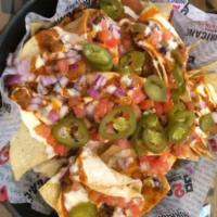 Hurricane Nachos · Crisp tortilla chips loaded with our House Chili, queso cheese and jalapeños. Drizzled with ...