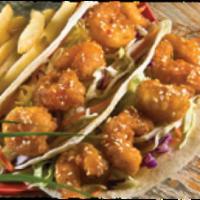 Firecracker Shrimp Tacos · Lightly-fried shrimp tossed in our Firecracker sauce. Served in two flour tortillas with our...