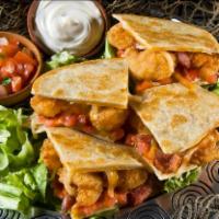 Shrimp BLT Quesadilla · A fusion of bold flavors, this grilled flour tortilla is chock full of fried shrimp, crumble...