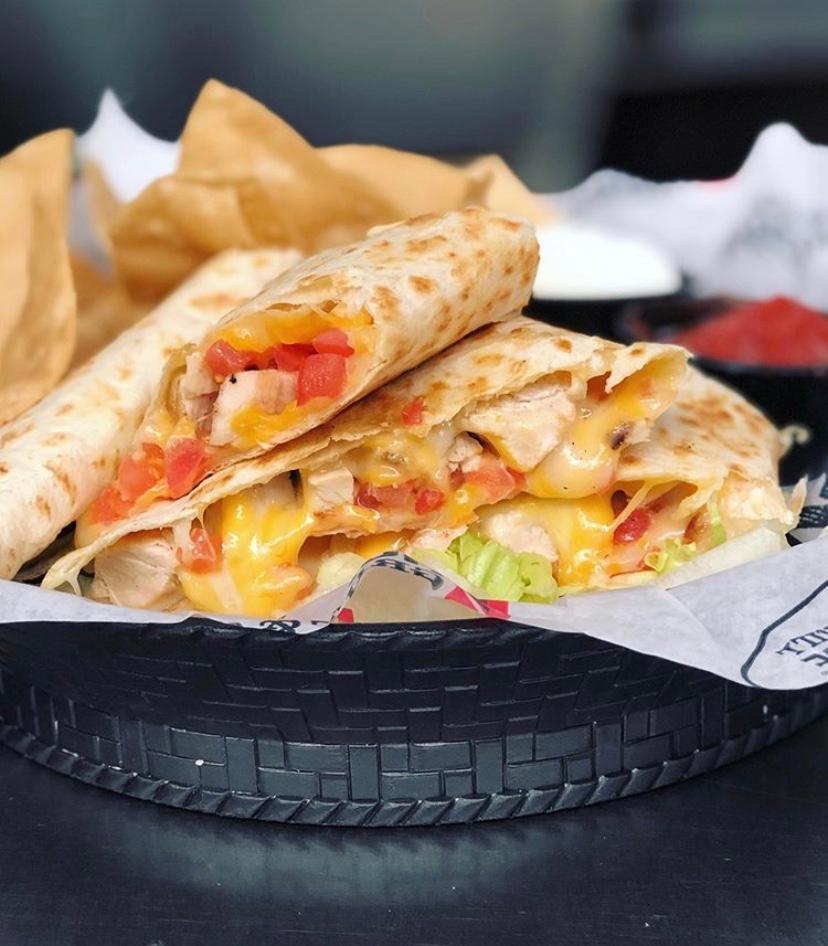 Monterey Chicken Quesadilla · Monterey jack and cheddar cheese melt together in a flour tortilla stuffed with tender grilled chicken and tomatoes. Served with sour cream and salsa for dipping. (990 cal.)