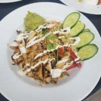 Thai Ginger Chicken Bowl · Sweet and spicy pineapple marinated chicken breast served over Cilantro Lime Rice with crisp...
