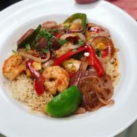 Calypso Seafood Rice Bowl · Cajun seasoned shrimp and mahi mahi sauteed with onions, peppers and ginger sauce. Served on...