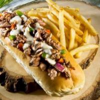 Steak Philly · Thinly sliced grilled steak piled high with sautéed grilled onions and peppers then topped w...
