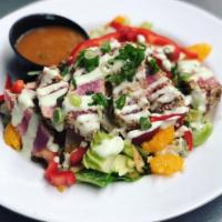 Seared Ahi Tuna Salad · Mixed greens tossed in a Mandarin Ginger dressing, topped with seared Ahi Tuna medallions, A...