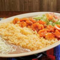 Camaron a La Diabla · Shrimp in red chili sauce. Served with rice, beans, lettuce, guacamole and corn tortillas.
