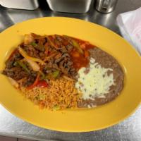 Steak Picado · Tender pieces of steak cooked with tomatoes, onions and bell peppers.