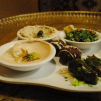 Mezza for 4 · Hummus, baba ghanouj and falafel, tabouli salad, grape leaves and fresh pita bread. Served w...