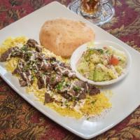 Lamb Shawarma Plate · Marinated strips of lamb. Served with petra salad and basmati rice, drizzled with our homema...
