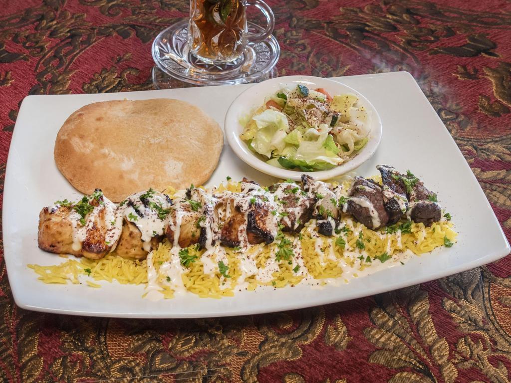 Kabab Mix Plate · Mixed marinated halal beef and halal chicken. Served with petra salad, basmati rice and drizzled with our homemade petra sauce. Served with homemade hot pita bread.