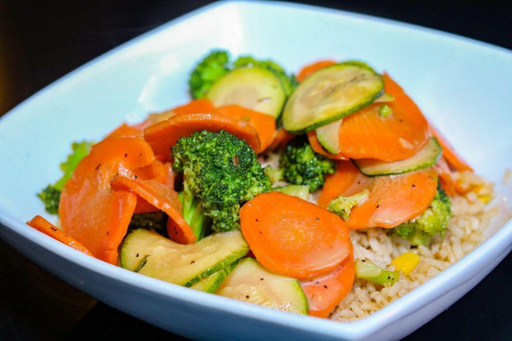 Carrot, Zucchini and Brocolli Stir-Fry · Sauteed with a roasted garlic balsamic served over brown rice. Gluten free. Vegetarian.