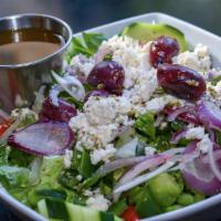 Greek Salad · Romaine lettuce, grape tomatoes, onions, cucumbers, olives, feta cheese, green peppers toppe...