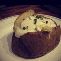 Baked Potato with Sour Cream · Add turkey bacon, scallions, cheddar, broccoli for an additional charge. Gluten free.