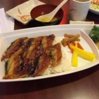 Una Don · Broiled eel over seasoned rice. Served with miso soup and green salad. 