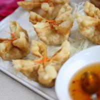 Crab Rangoon · A mixture of crab and cream cheese, stuffed in wonton skin in the form of a flower shape.