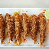 Coconut Shrimp · Covered with fresh coconut flakes and topped with pineapple sauce.
