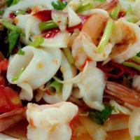 Spicy Seafood Salad · Steamed medley of shrimps, scallop, squid, and mussels flavored with spicy lime dressing mix...