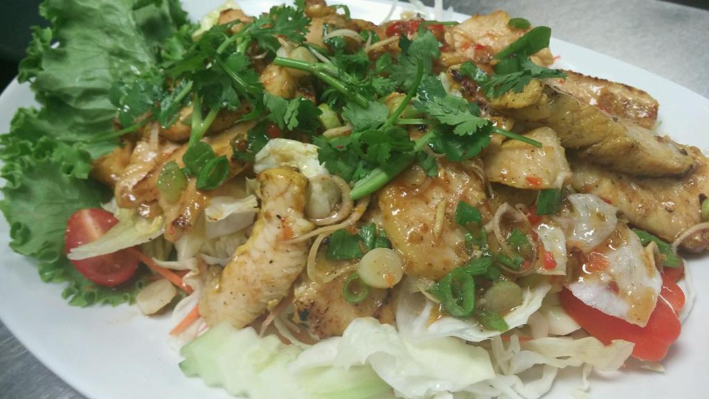 Lemongrass Chicken Salad · Shredded grilled chicken with greens, carrots and topped with vinaigrette honey dressing.