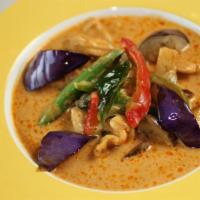 Red Curry · Red curry with eggplants, bamboo shoots, bell peppers, sweet basil leaves and green beans. S...