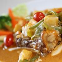 5 Spices Duck Curry · Roasted duck meat with pineapple and cherry tomatoes in red curry sauce.