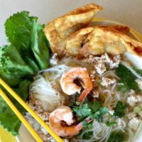 Tom Yum Noodle Soup · Tom yum is a spicy clear soup. Served with rice noodle, minced chicken, shrimps, grounded pe...