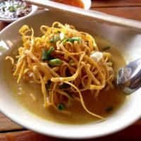 Khao Soi · This northern Thai dish, with slices of chicken simmered with cooked egg noodles in a rich c...