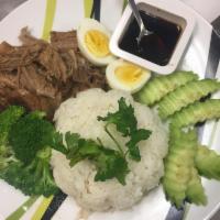 Braised Pork Over Steamed Rice · Thick sweet and savory sauce with melt in the mouth pork as a result of sizzling fragrant po...