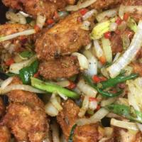 Pepper Salted Chicken Wings · Wings are fried to a crunchy golden brown and then tossed in a garlic, red chili, white and ...