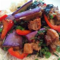 Spicy Eggplant · Savory bite sized eggplants tossed with onions, bell peppers and basil, with a pinch of Thai...