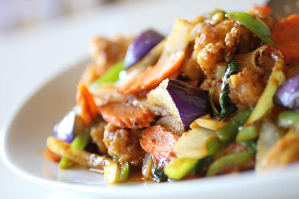 Pad Ped · Spicy chili paste mixed with onions, bell peppers, sweet basil leaves, bamboo shoots, eggplants and carrots. Spicy.