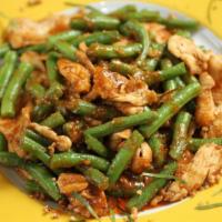 Pad Prik King · Homemade red curry paste stir fried with fresh cut green bean, and topped with grounded pean...