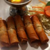 A2. Fried Spring Rolls · Thai style spring rolls stuffed with transparent noodles and vegetables served with plum sau...
