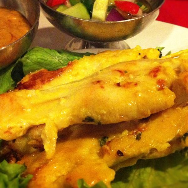 A4. Sa-Tae · Chicken marinated in Thai curry, skewered, grilled and served with peanut sauce and cucumber salad.