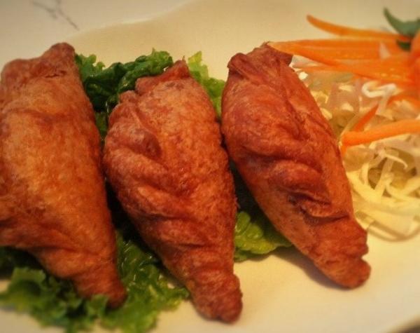 A8. Karee Puffs · Golden brown soft and crispy croissant bread filled with minced chicken, snow peas, potato and carrot.