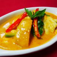 CU5. Red Curry · Choice of meat with bamboo shoots, eggplant and basil with rich red curry in coconut milk.