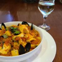 Cioppino · Shrimp, mussels, clams,calamari,scallops and fresh fish over linguine pasta with fresh garli...