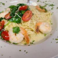 Shrimp Scampi · Jumbo shrimps over Angel hair pasta with garlic lemon sauce,cherry tomatoes and fresh spinach.